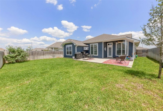 back of property featuring a ceiling fan and a patio area