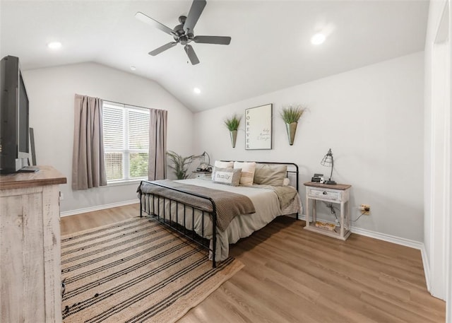 bedroom featuring light wood-type flooring, vaulted ceiling, baseboards, recessed lighting, and ceiling fan