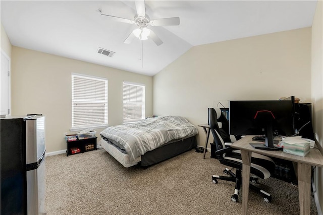 carpeted bedroom with visible vents, a ceiling fan, freestanding refrigerator, baseboards, and lofted ceiling