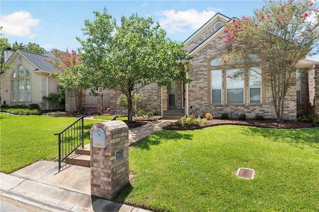 view of front of home with a front lawn