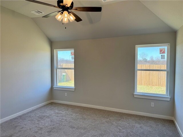 empty room featuring vaulted ceiling