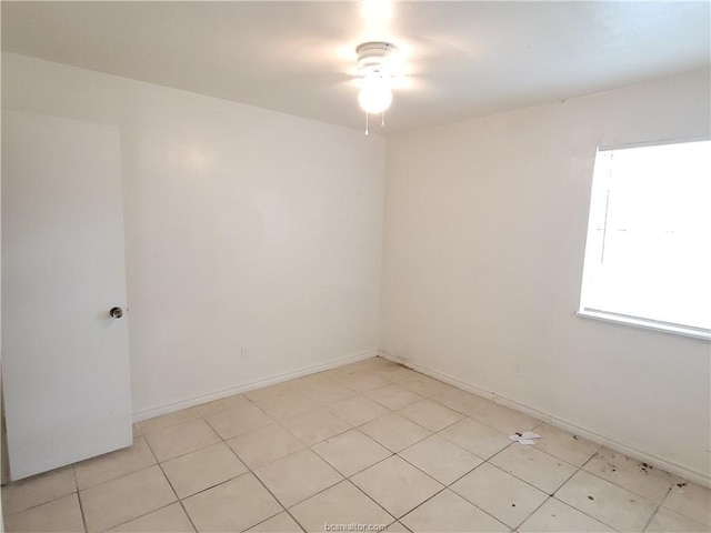 empty room with light tile patterned flooring