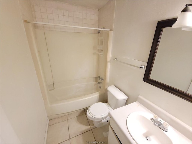 full bathroom with tile patterned floors, tiled shower / bath, vanity, and toilet