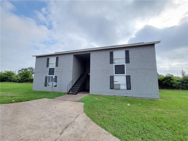 exterior space featuring a front lawn