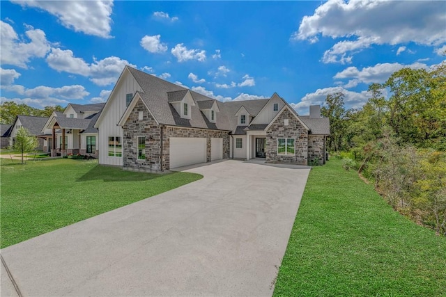 view of front of house with a front yard and a garage