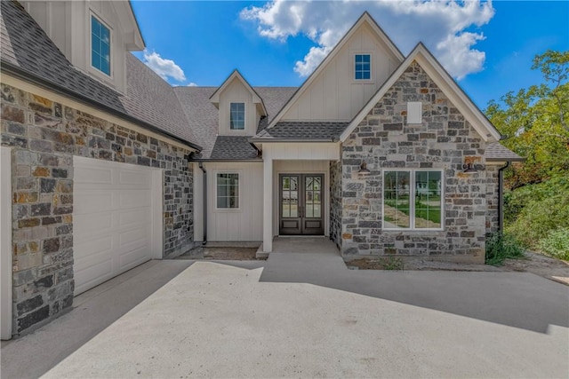 view of front of property featuring french doors and a garage