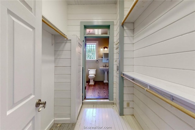 spacious closet featuring light hardwood / wood-style flooring