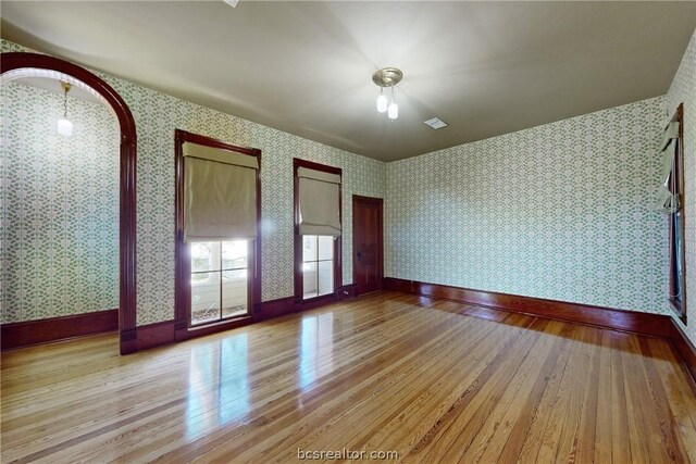 unfurnished bedroom featuring light wood-type flooring