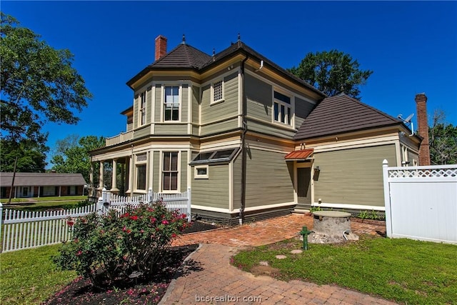 rear view of house with a lawn