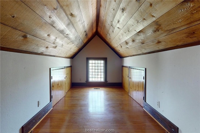 bonus room with wood ceiling, vaulted ceiling, and light hardwood / wood-style floors