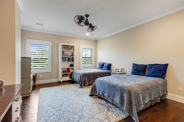 5311 Riviera Ct, College Station, TX 77845 - bedroom with dark wood finished floors, multiple windows, ornamental molding, baseboards, and recessed lighting