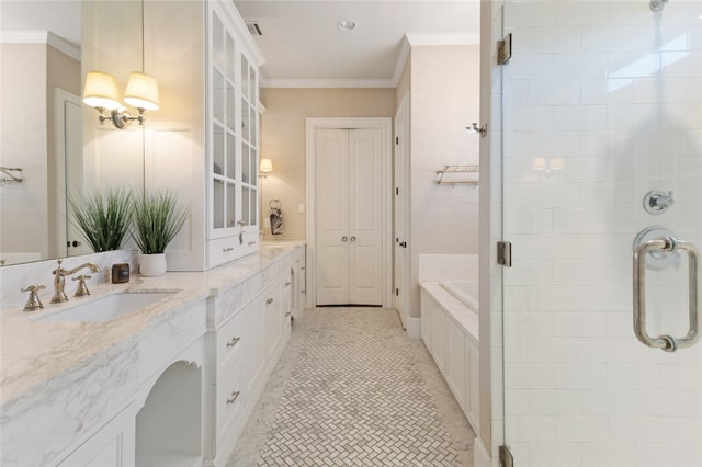 5311 Riviera Ct, College Station, TX 77845 - full bathroom with a shower stall, crown molding, double vanity, a garden tub, and tile patterned flooring