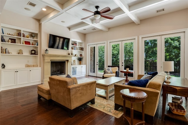 5311 Riviera Ct, College Station, TX 77845 - living area featuring dark wood-style flooring, coffered ceiling, french doors, beam ceiling, and a fireplace with raised hearth