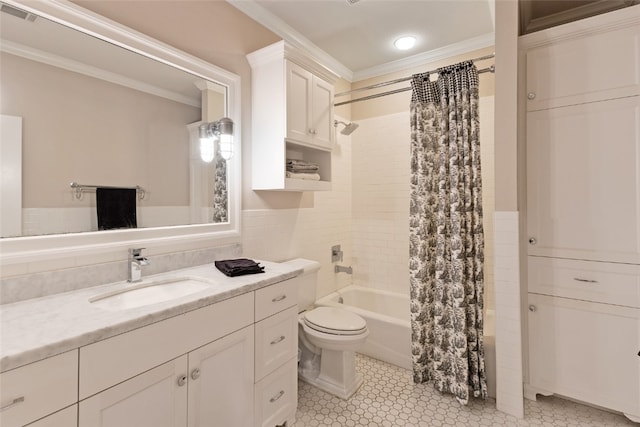 5311 Riviera Ct, College Station, TX 77845 - bathroom featuring ornamental molding, shower / bathtub combination with curtain, toilet, vanity, and tile walls