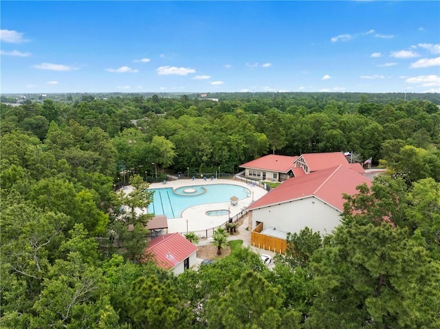 birds eye view of property with a forest view