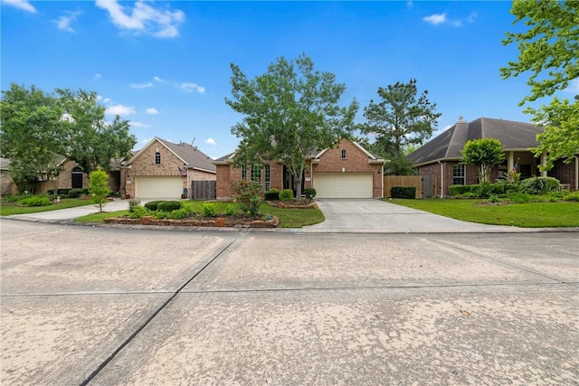 ranch-style home featuring a residential view, a garage, brick siding, fence, and concrete driveway