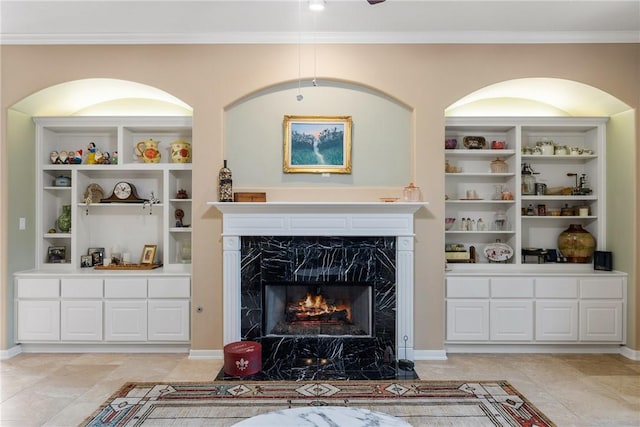 living area featuring ornamental molding, light tile patterned flooring, and a fireplace