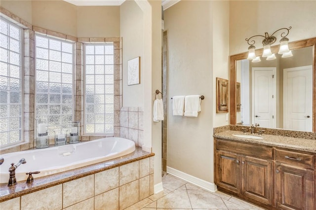 full bathroom featuring vanity, tile patterned flooring, a bath, and a healthy amount of sunlight