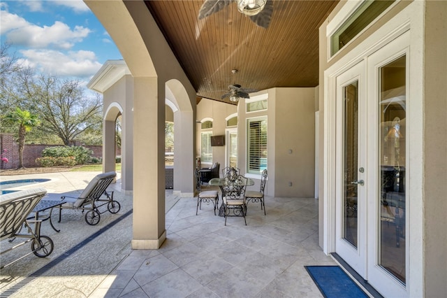 view of patio / terrace with outdoor dining area and a ceiling fan