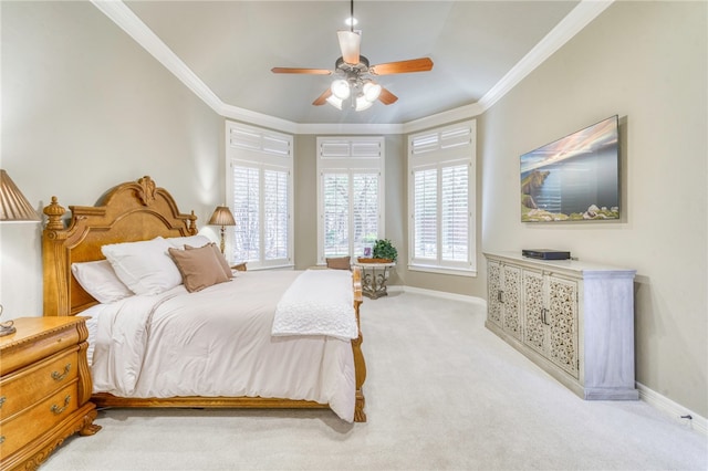 bedroom with light carpet, baseboards, crown molding, and ceiling fan