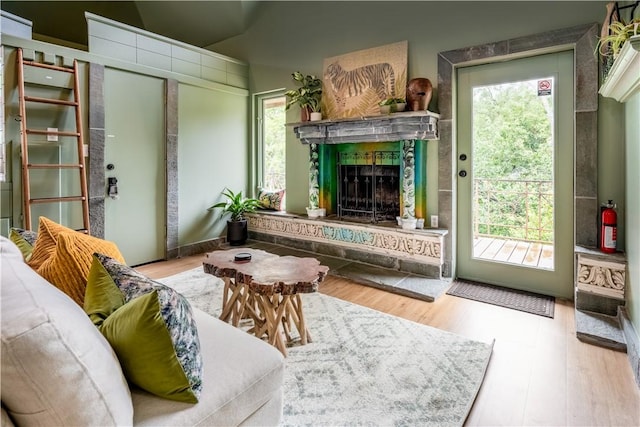 living room featuring hardwood / wood-style floors and lofted ceiling