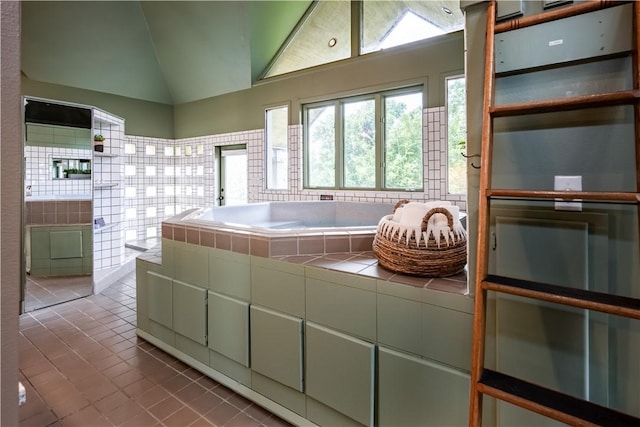 bathroom with tile patterned floors and lofted ceiling