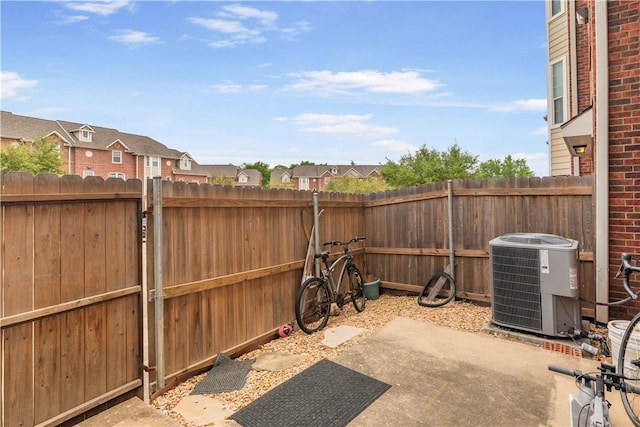 305 Holleman Dr E Unit 202, College Station, TX 77840 - view of patio / terrace featuring a fenced backyard and cooling unit