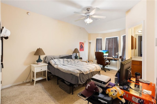 305 Holleman Dr E Unit 202, College Station, TX 77840 - bedroom featuring baseboards, a ceiling fan, and light colored carpet