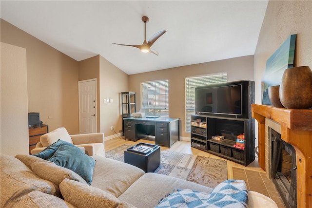 1501 Stallings Dr Unit 54, College Station, TX 77840 - living room with vaulted ceiling, ceiling fan, light wood-style flooring, baseboards, and a fireplace with flush hearth
