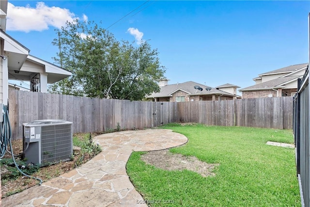 view of yard with a patio and central AC