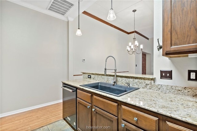 kitchen featuring dishwasher, light wood-type flooring, crown molding, and sink