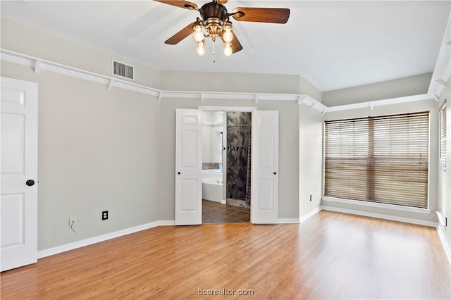 spare room with light hardwood / wood-style floors and ceiling fan