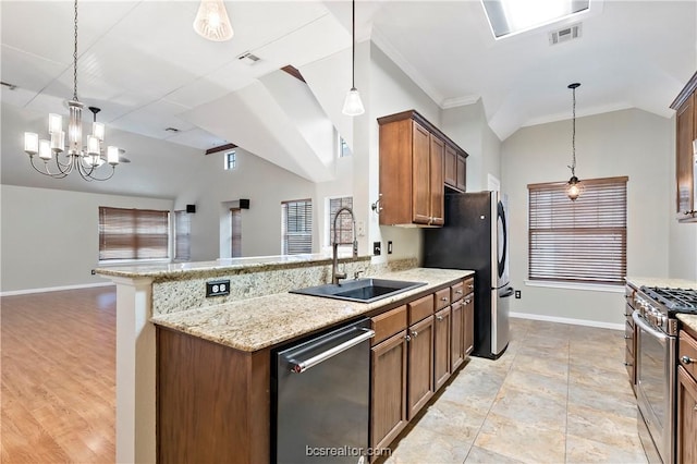 kitchen featuring pendant lighting, a chandelier, sink, and stainless steel appliances