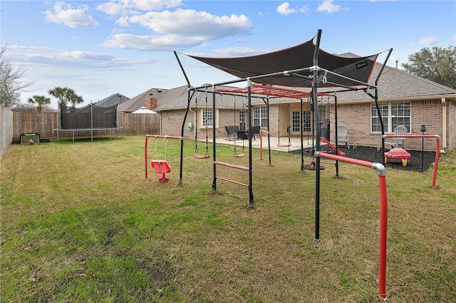 view of playground featuring a yard and a trampoline