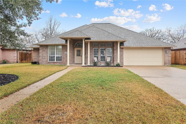 view of front of house with a front lawn and a garage