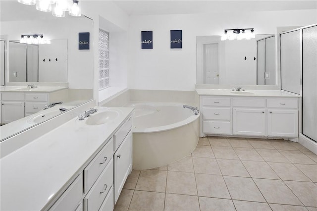 bathroom featuring tile patterned floors, vanity, and independent shower and bath