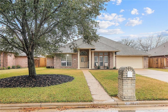 ranch-style home with a front lawn and a garage