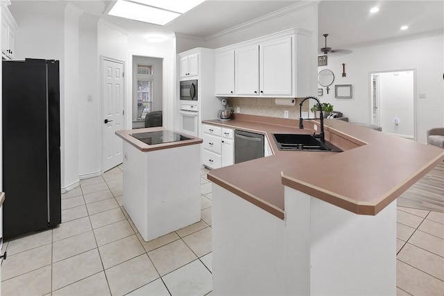 kitchen with a kitchen island, sink, white cabinetry, and black appliances