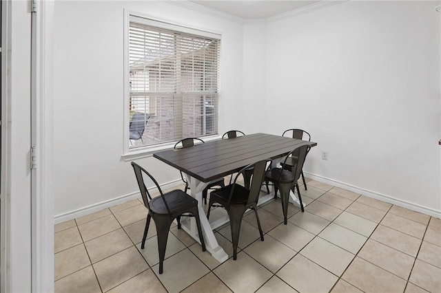 dining space with light tile patterned flooring and crown molding