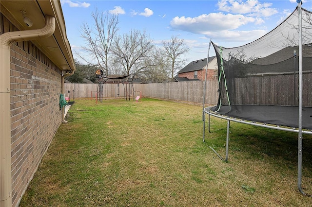 view of yard with a trampoline