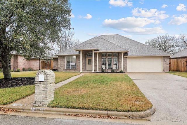 view of front facade with a front lawn and a garage