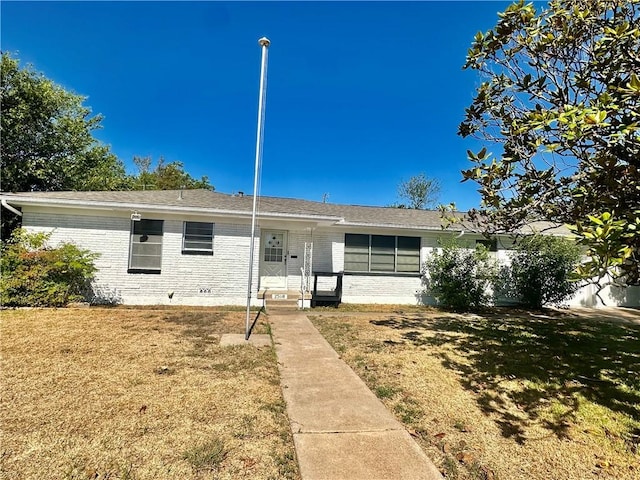 ranch-style house with a front yard