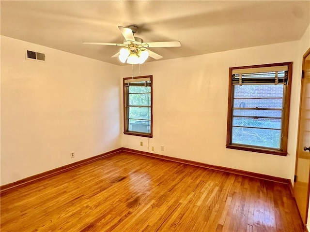 empty room featuring ceiling fan and wood-type flooring