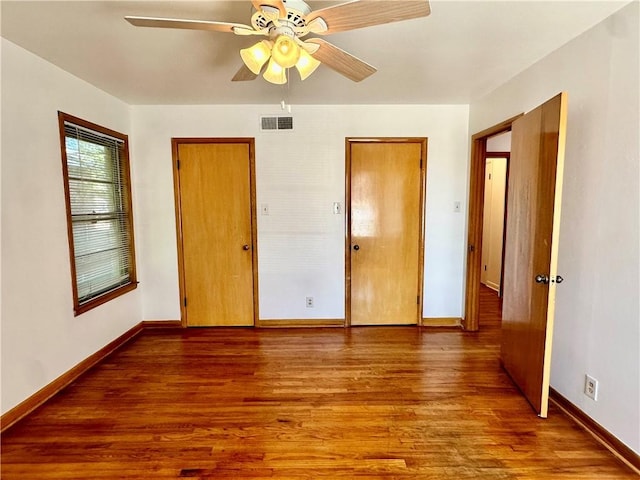 unfurnished bedroom with hardwood / wood-style floors and ceiling fan