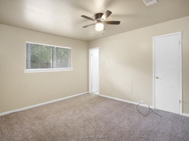 carpeted empty room with ceiling fan