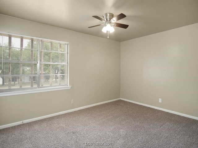 spare room with carpet flooring and ceiling fan