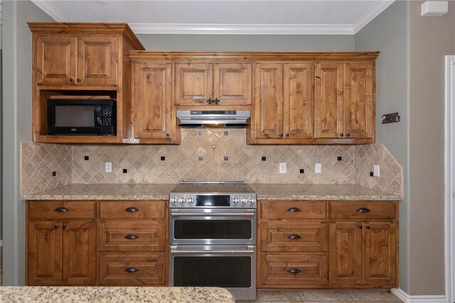 kitchen with brown cabinets, black microwave, under cabinet range hood, and double oven range