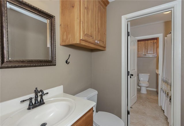 full bathroom featuring vanity and toilet