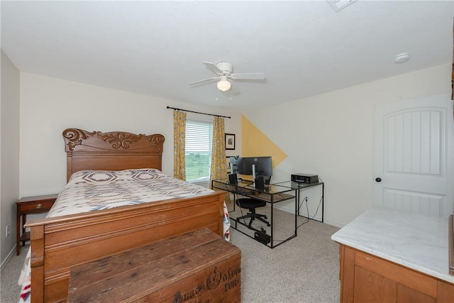 bedroom with light carpet, a ceiling fan, and baseboards