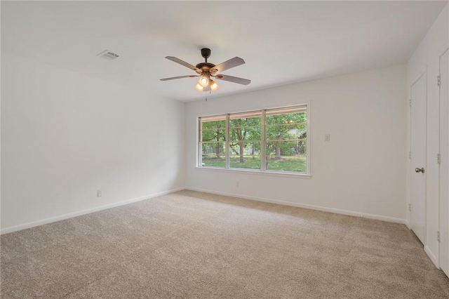 unfurnished bedroom with baseboards, a ceiling fan, and light carpet